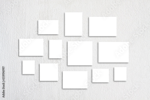 Blank canvas set , twelve posters collage isolated on white plastered wall, interior decor mock up