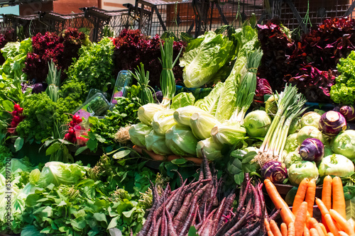 vegetable Market. organic fresh vegetables on market counter. Sale of vegetables and greens