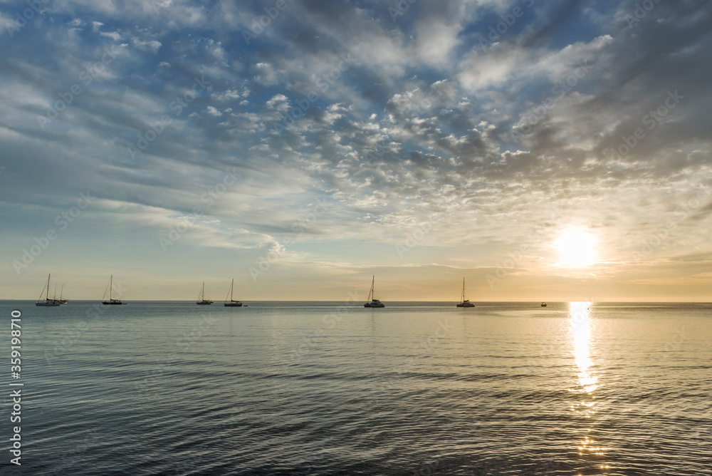 Fototapeta premium Yachts at sea at dawn.