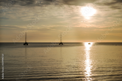 Yachts at sea at dawn. © kamira