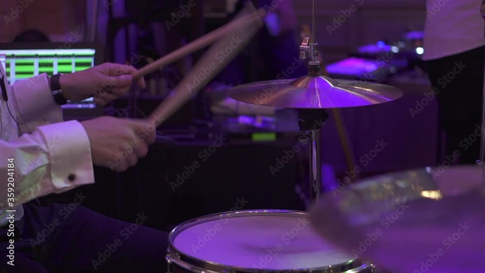 A drummer plays in a bar under light music. High quality FullHD footage A drummer plays in a bar under light music. High quality FullHD footage