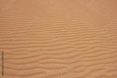 Hot and arid desert sand dunes terrain in Sharjah emirate in the United Arab Emirates. The oil-rich UAE receives less than 4 inches of rainfall a year and relies on water from desalination plants. © Arnold Pinto