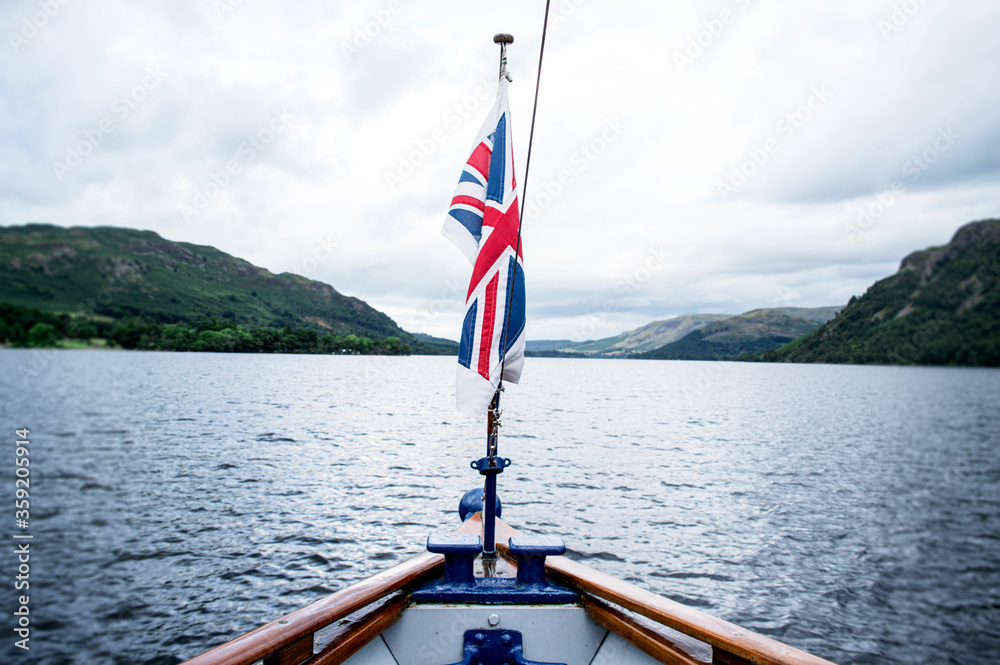 Fototapeta premium boat on the lake. With Union Jack flag