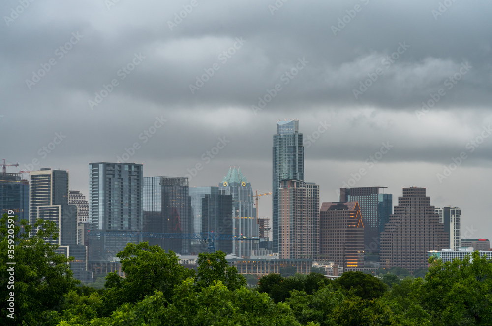 View of Austin Texas Main Buildings and Cranes in the SKyline With Storm Passing By