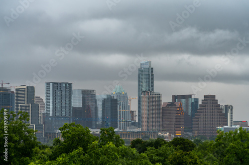 View of Austin Texas Main Buildings and Cranes in the SKyline With Storm Passing By