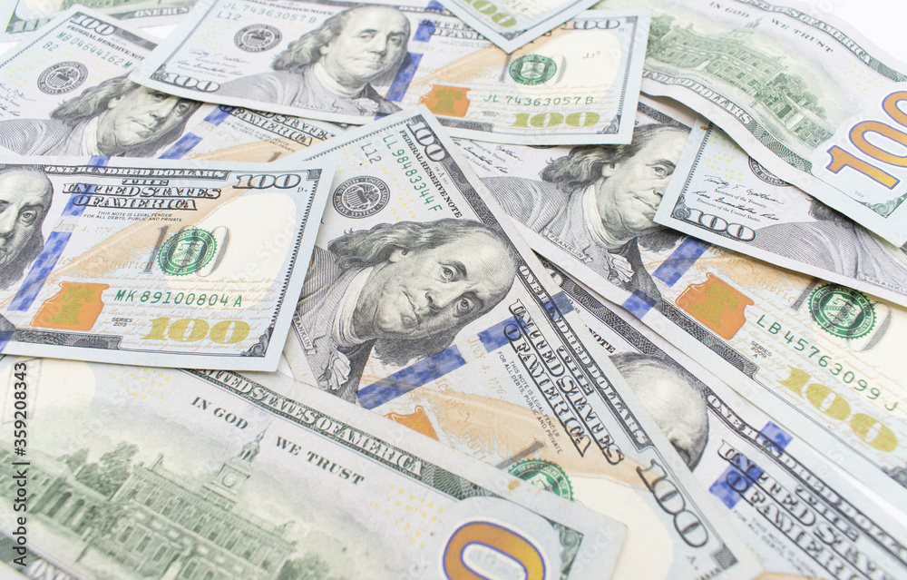 Dolar. american dollars in one hundred banknotes. 100 new us dollar banknotes as background Dolar. american dollars in one hundred banknotes. 100 new us dollar banknotes as background