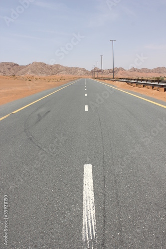 Hot and arid desert sand dunes terrain in Sharjah emirate in the United Arab Emirates. The oil-rich UAE receives less than 4 inches of rainfall a year and relies on water from desalination plants.
