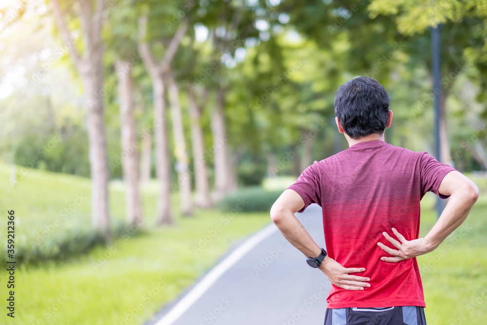 Young adult male with his muscle pain during running. runner man having back body ache due to Piriformis Syndrome, Low Back Pain and Spinal Compression. Sports injuries and medical concept Young adult male with his muscle pain during running. runner man having back body ache due to Piriformis Syndrome, Low Back Pain and Spinal Compression. Sports injuries and medical concept