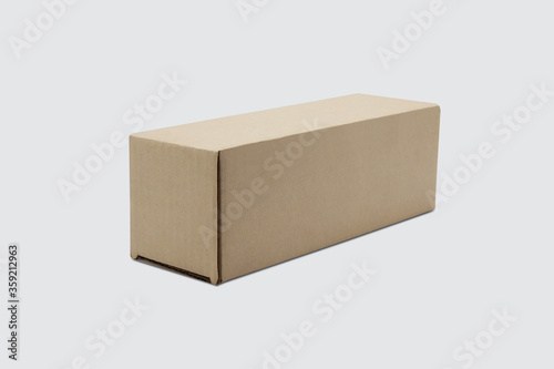 Mockup closed brown packaging paper box isolated on white background. © N_studio