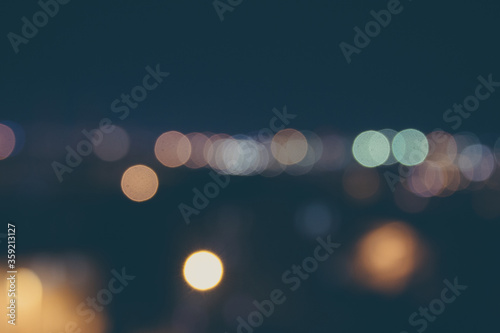 Night blur lights. Abstract of vintage bokeh background with retro effect.