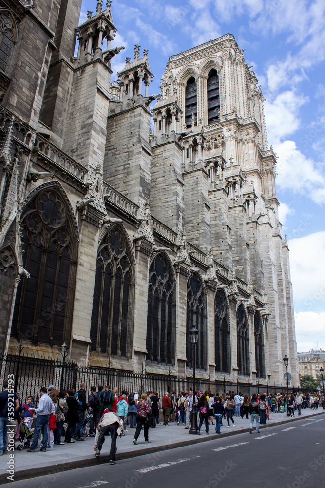 Long waiting line of  visitor to visit Notre Dame cathedral, Paris France