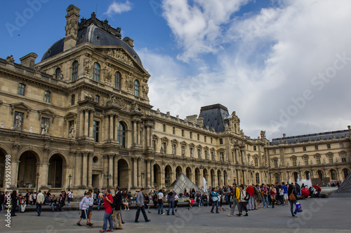 View of Louvre museum  the most famous visited museum in the world with tourist on weekend, Paris France photo
