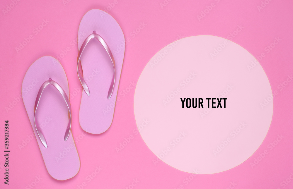Pink flip flops on yellow background with pink pastel circle for copy space. Minimalistic vacation on the beach concept. Summer time. Copy space