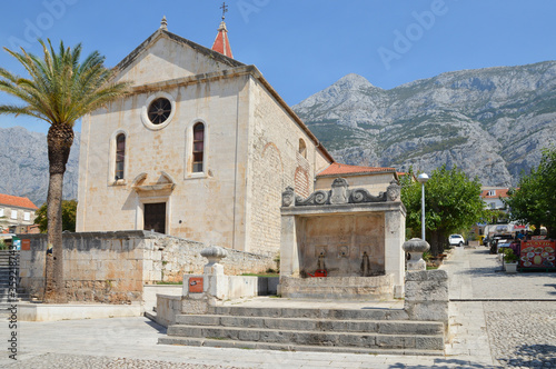 A square in the Croatian town of Makarska on a summer day. photo