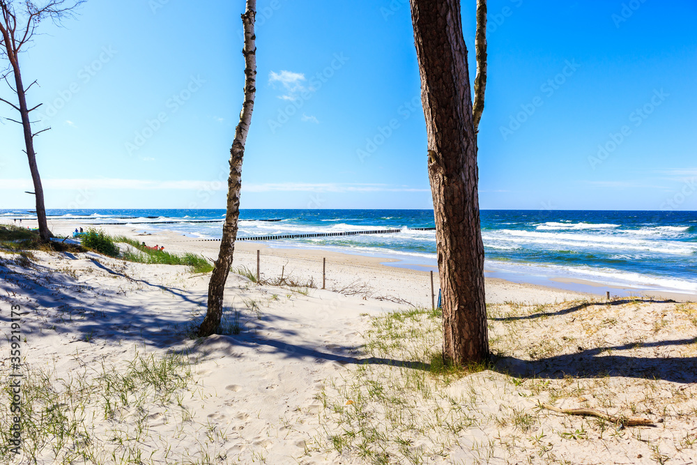 Beautiful white sand beach and blue sea near Kolobrzeg, Baltic Sea coast, Poland Beautiful white sand beach and blue sea near Kolobrzeg, Baltic Sea coast, Poland