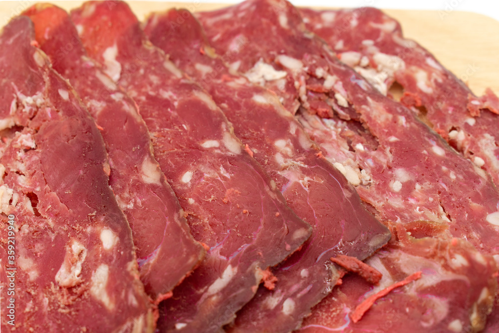 Turkish bacon on white background. thinly sliced bacon. Turkey meat special to the city of Kayseri. Turkish bacon on white background. thinly sliced bacon. Turkey meat special to the city of Kayseri.