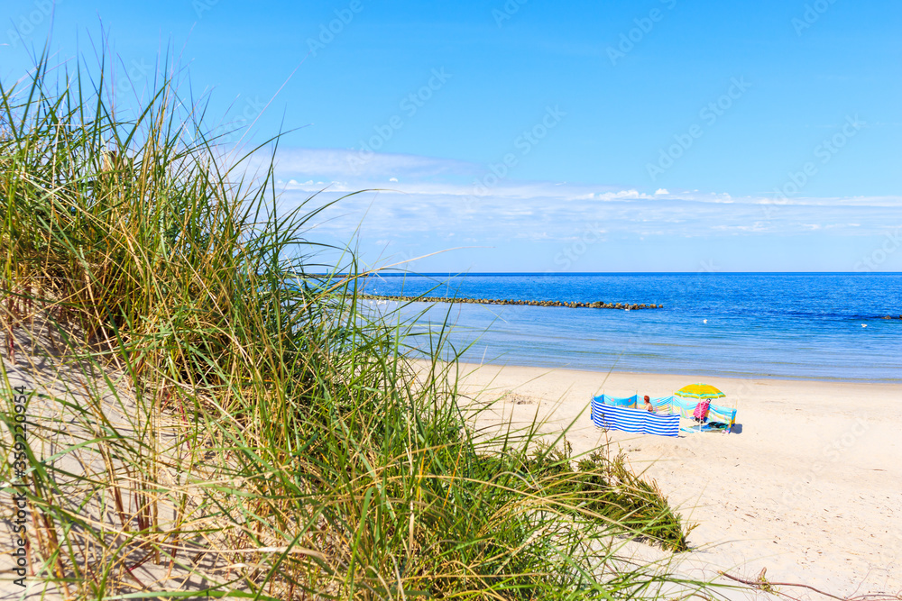 Beautiful white sand beach and blue sea near Kolobrzeg, Baltic Sea coast, Poland Beautiful white sand beach and blue sea near Kolobrzeg, Baltic Sea coast, Poland