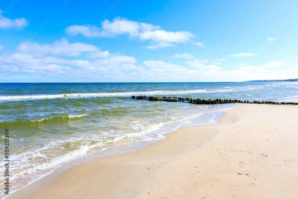 Beautiful white sand beach and blue sea near Kolobrzeg, Baltic Sea coast, Poland Beautiful white sand beach and blue sea near Kolobrzeg, Baltic Sea coast, Poland