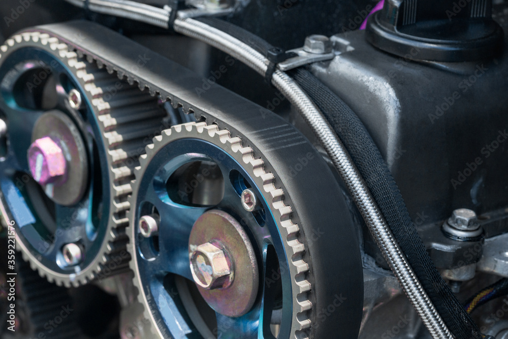 Timing belt and twin camshaft sprocket in engine racing car. Timing belt and twin camshaft sprocket in engine racing car.