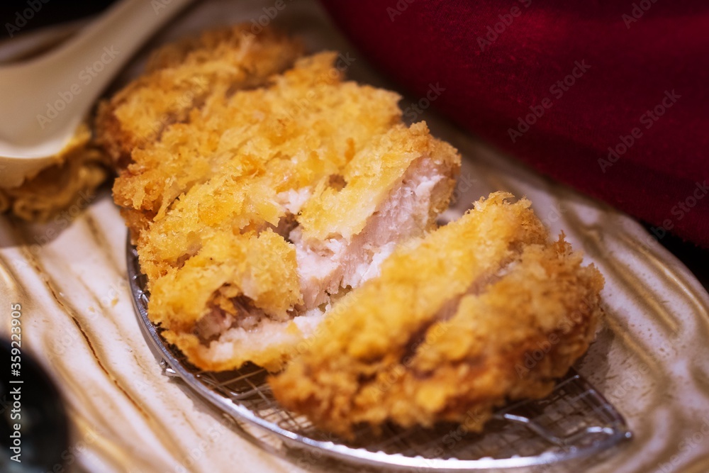 Close up of Tonkatsu panko breaded deep fried pork cutlet thai street food market Close up of Tonkatsu panko breaded deep fried pork cutlet thai street food market