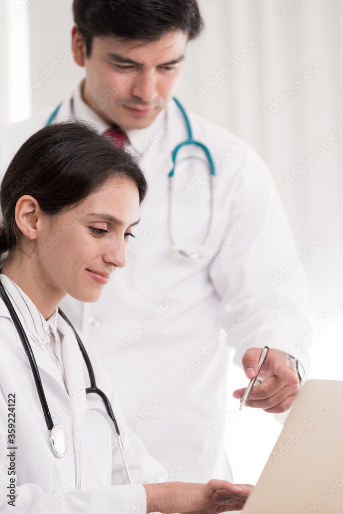 Two doctors have working together with happiness in the hospital. Two doctors have working together with happiness in the hospital.