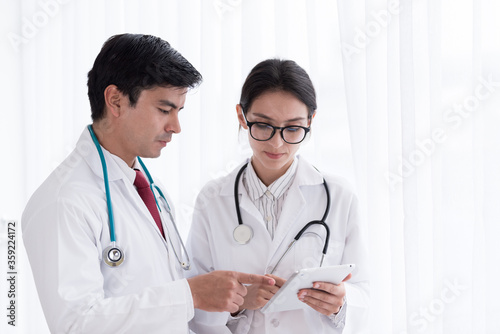 Two doctors have working together with happiness in the hospital.