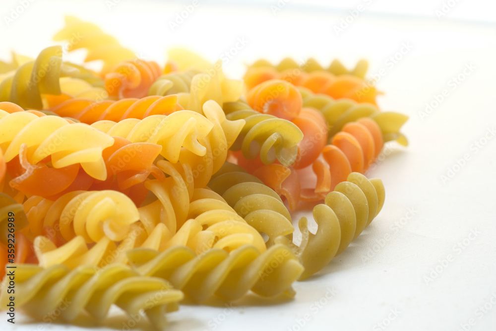 Close up of uncooked macaroni isolated on white Close up of uncooked macaroni isolated on white