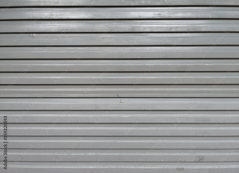 Perforated metal garage door texture background. Copy space. Perforated metal garage door texture background. Copy space.