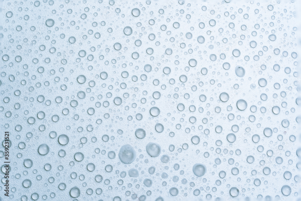 Water drops on a light blue background