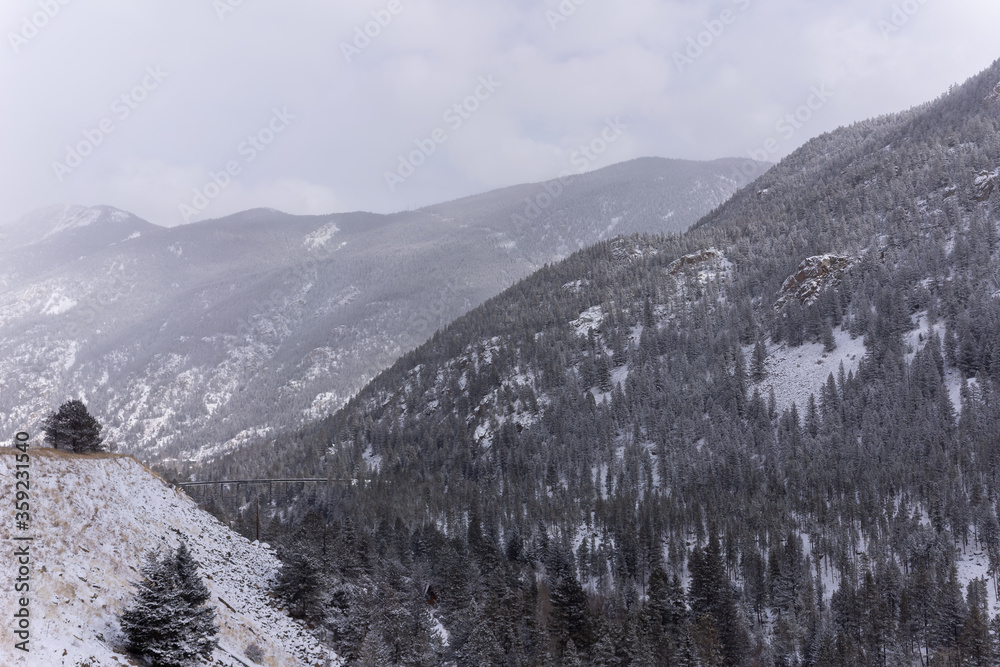 Fototapeta premium Snowy Rocky Mountains outside of Denver Colorado, highway to ski resorts