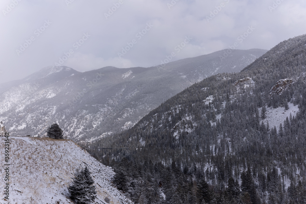 Obraz premium Snowy Rocky Mountains outside of Denver Colorado, highway to ski resorts