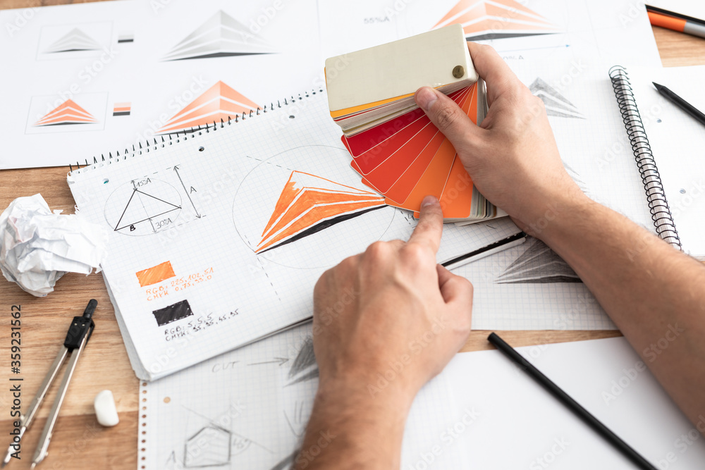 © REDPIXEL - Graphic designer drawing sketches logo design. © REDPIXEL - Graphic designer drawing sketches logo design.