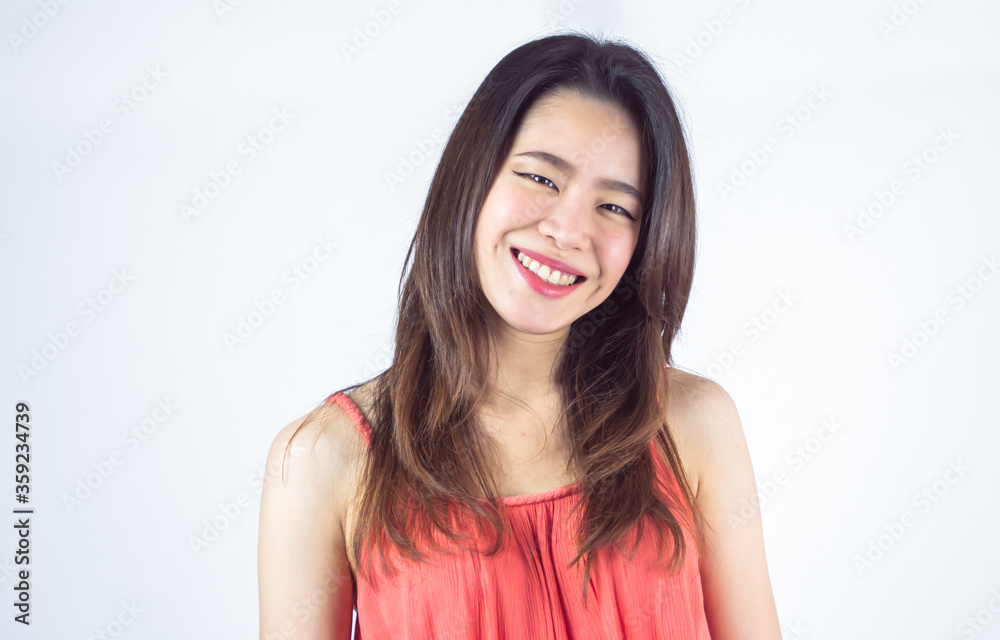 Asian woman smiling and wearing pink shirt for summer vacation Asian woman smiling and wearing pink shirt for summer vacation