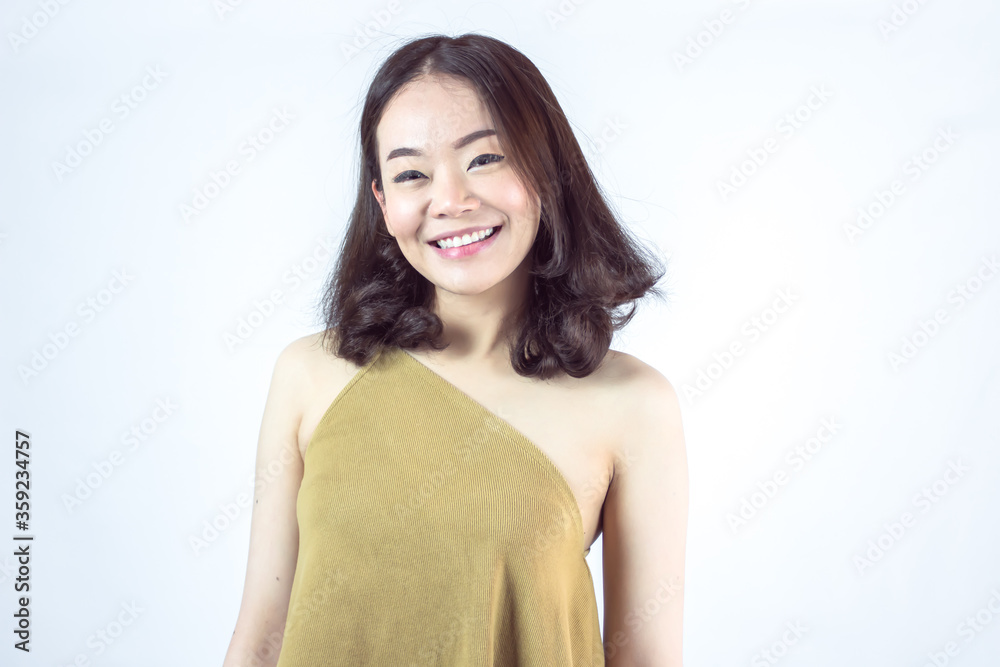 Asian woman smiling and wearing brown shirt for summer vacation Asian woman smiling and wearing brown shirt for summer vacation