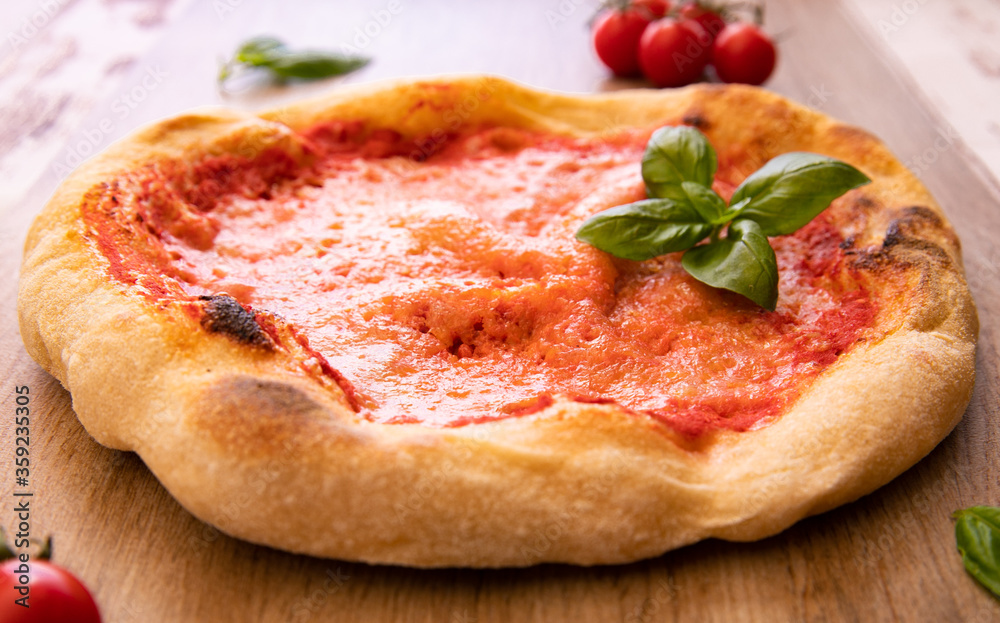 Italian homemade pizza with fresh basil