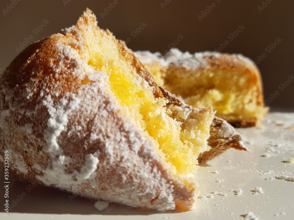 Pandoro is a Christmas cake in Italy. Macro of a piece of Pandoro. Pandoro is a Christmas cake in Italy. Macro of a piece of Pandoro.