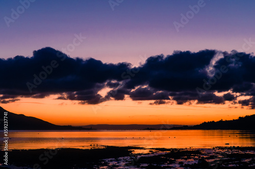 Sun rise during winter, taken from Lamlash on the Isle of Arran on the west coast of Scotland, looking out over Lamlash Bay towards the mainland.