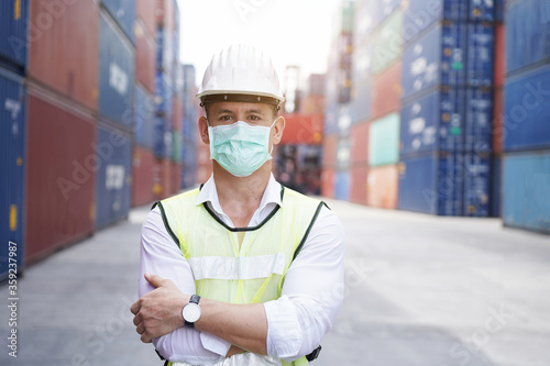 new normal concept,Portrait of the inspecting engineer Wear mask and helmet for safety while working in factory or warehouse background.Prevent accident from work or dust and Coronavirus.
