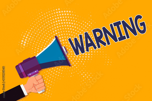 Photography Conceptual hand writing showing Warning