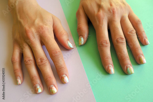summer gentle pastel manicure on women s hands
