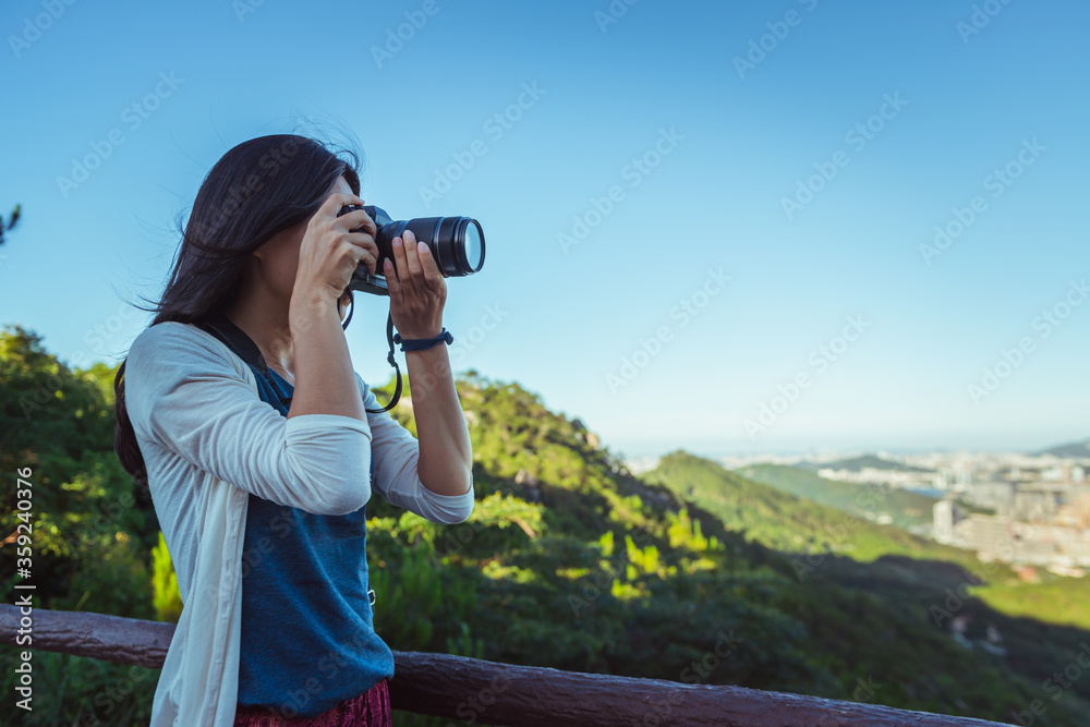 Asian girl takin pictures of landscapes Asian girl takin pictures of landscapes