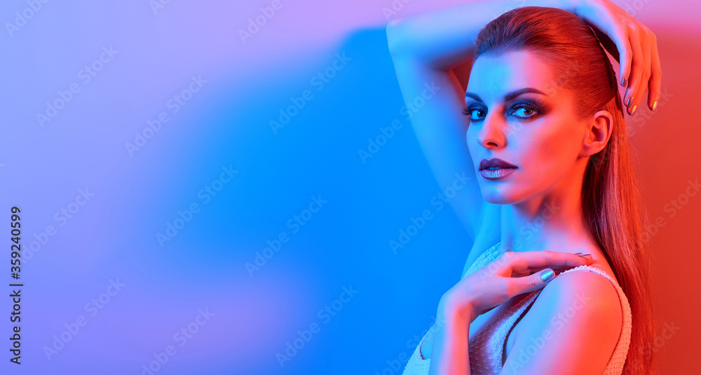 High Fashion. Woman in colorful neon light, make-up. Sexy girl, stylish hair, trendy makeup. Party disco neon style. Creative art beauty portrait, fashionable model face, bright make up High Fashion. Woman in colorful neon light, make-up. Sexy girl, stylish hair, trendy makeup. Party disco neon style. Creative art beauty portrait, fashionable model face, bright make up