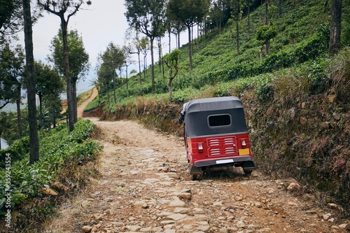 Tuk tuk on dirt road © Chalabala