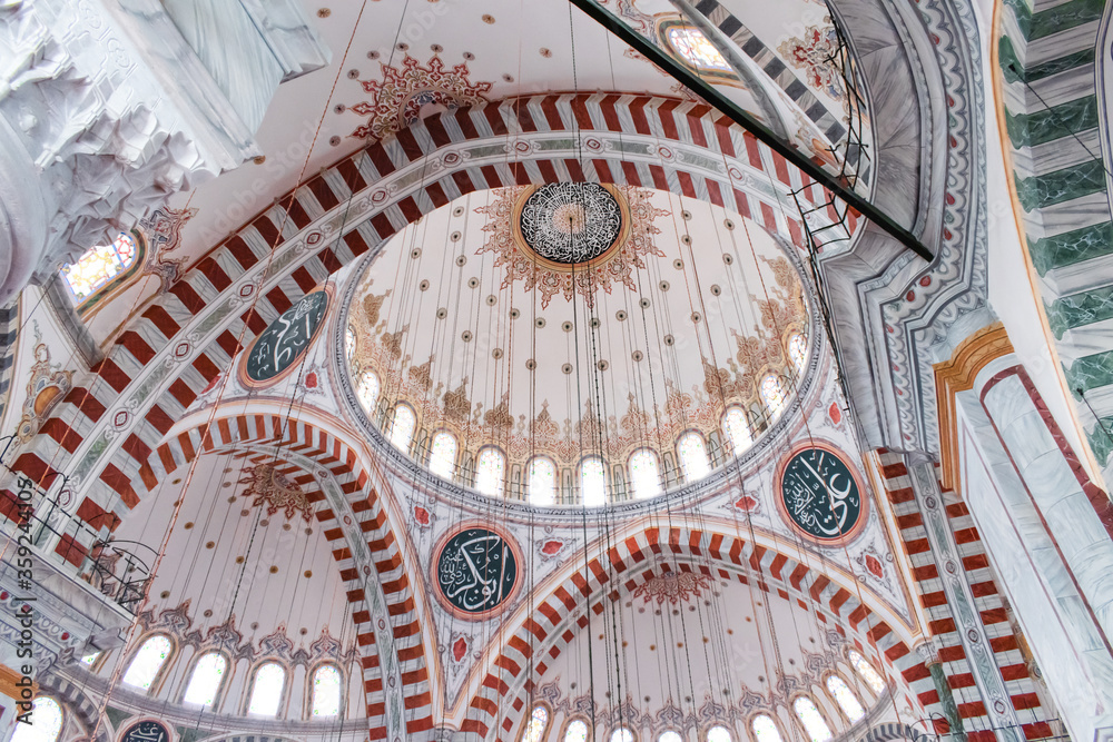 Istanbul , Turkey / July 2019 Fatih Mosque and Complex is a mosque and complex built by Fatih Sultan Mehmed in Fatih district of Istanbul. Interior architecture of the mosque, dome, columns and light