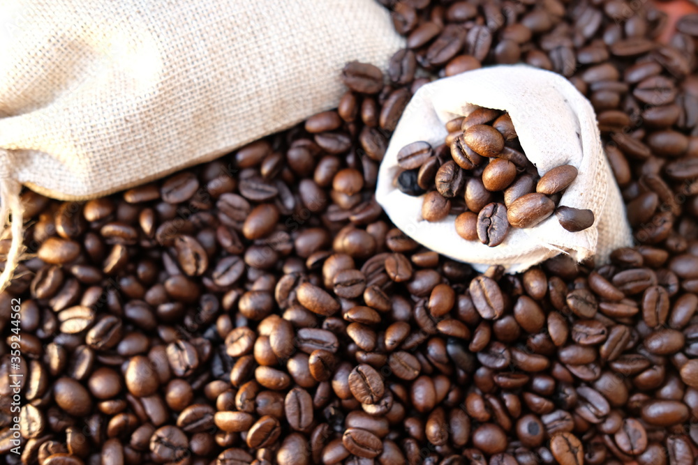 close up coffee beans and macro coffee beans on wood table background