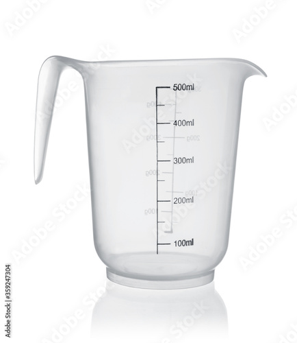 Measuring plastic cup isolated on white.