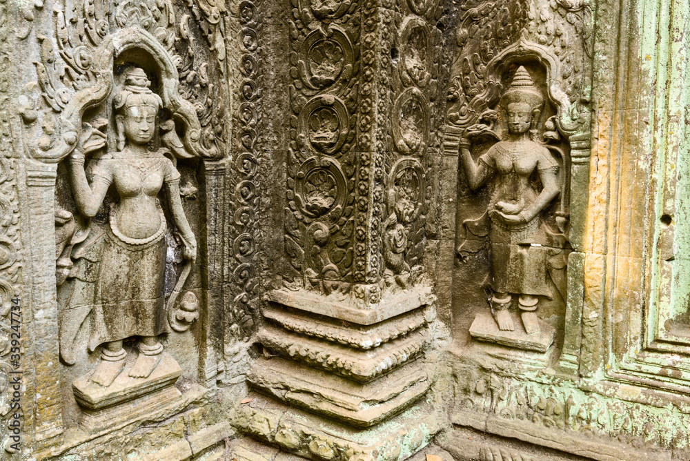 statue of a apsara, a female spirit in the ruins of Ta Prohm temple in siem reap, Cambodia