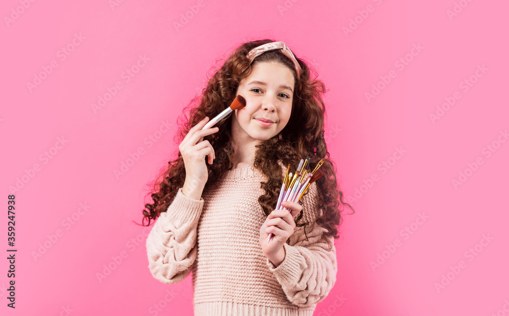 beautiful kid play cosmetics. Beauty salon. happy childhood. fashion and beauty. retro girl put natural makeup with brush. hair and skin care. small girl wear vintage headband beautiful kid play cosmetics. Beauty salon. happy childhood. fashion and beauty. retro girl put natural makeup with brush. hair and skin care. small girl wear vintage headband