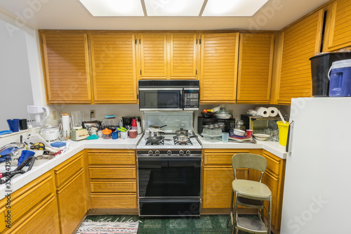 Messy condo kitchen with oa...