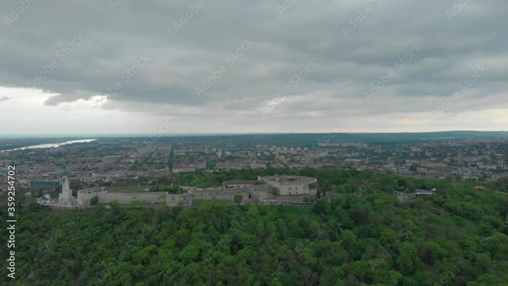 The Beautiful Liberty Statue Situated On Top Of Gellert Hill In Budapest Hungary - aerial drone shot The Beautiful Liberty Statue Situated On Top Of Gellert Hill In Budapest Hungary - aerial drone shot